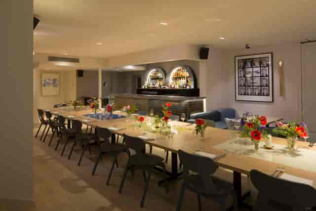 Gennaro Room at The Groucho Club: elegant event space with floral centerpieces for gatherings.