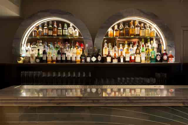 Gennaro Room bar at The Groucho Club, stylish spirits display for cocktail receptions.