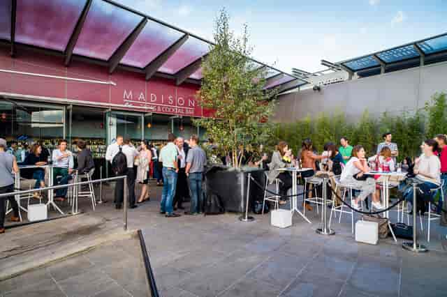 Vibrant outdoor event space with greenery for networking and social gatherings in Madison.