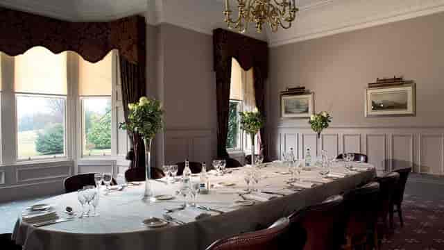 Elegant dining setup in Norton House Hotel meeting room with fine china and floral centerpieces.