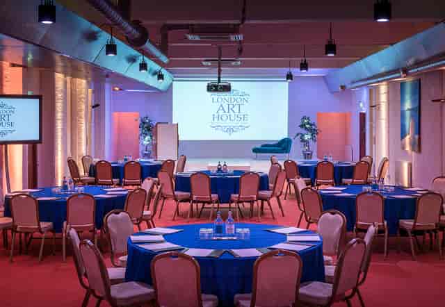 London Art House ballroom with stage for corporate workshops and seated presentations.