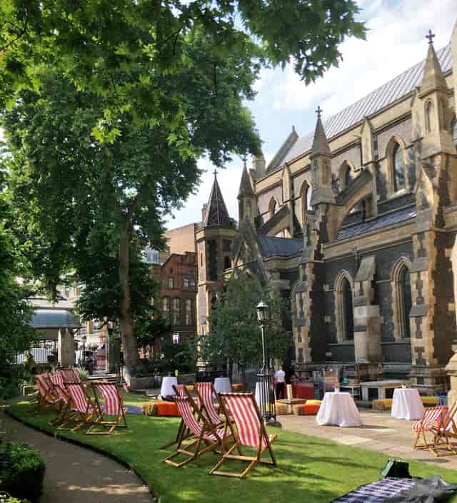 Southwark Cathedral Churchyard: elegant outdoor venue for events with lush trees.