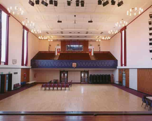 Spacious Brierley Hill Civic Hall bar area with polished wood floor for events and conferences.