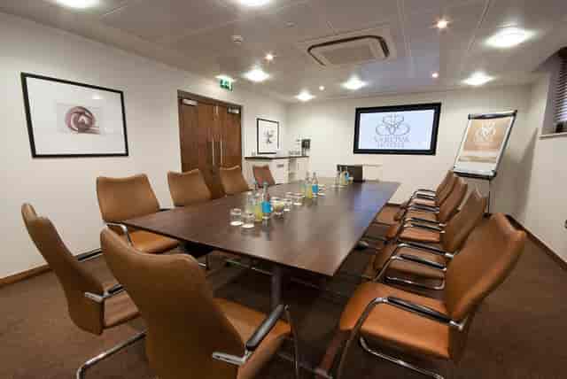 Balmoral Suite meeting room with long table, ideal for professional events and presentations.