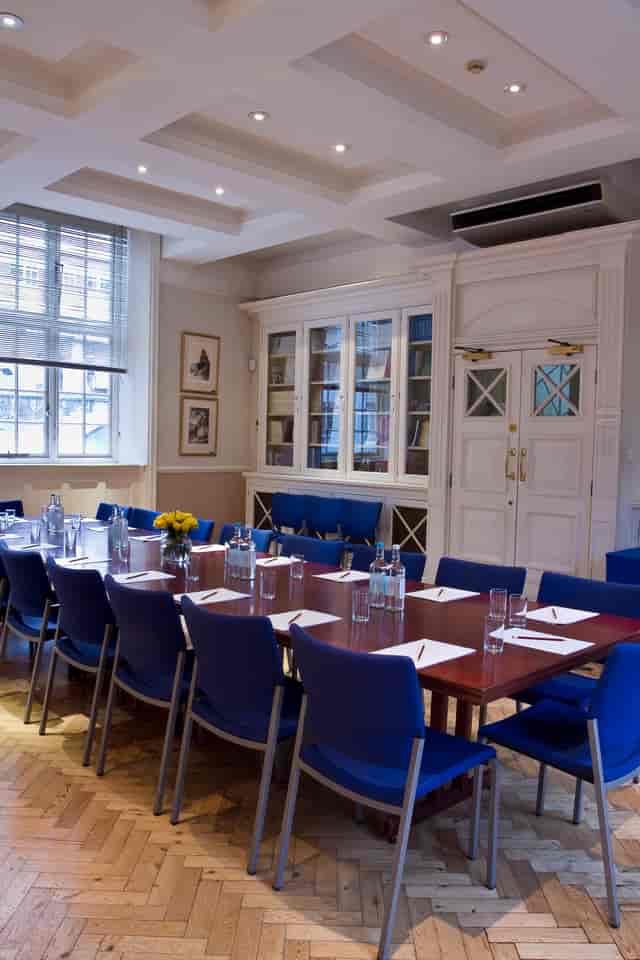 Boardroom at The Hellenic Centre with wooden table, ideal for meetings and workshops.