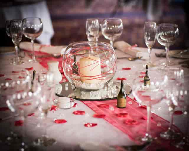 Elegant Shaw Suite table setting with candle centerpiece for weddings and formal events.