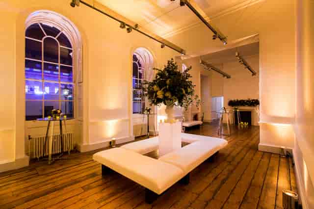 Elegant event space in Somerset House with floral arrangement, ideal for gatherings.