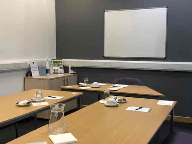 Boardroom in Capability House with organized tables for workshops and meetings.