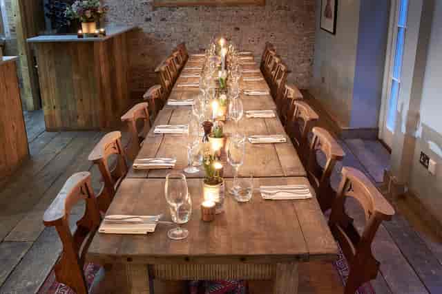 Intimate gathering at Club Room, Artist Residence London with elegant table settings.