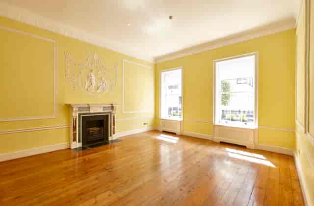 Elegant meeting space in Hutchison Room, Asia House with natural light and classic fireplace.