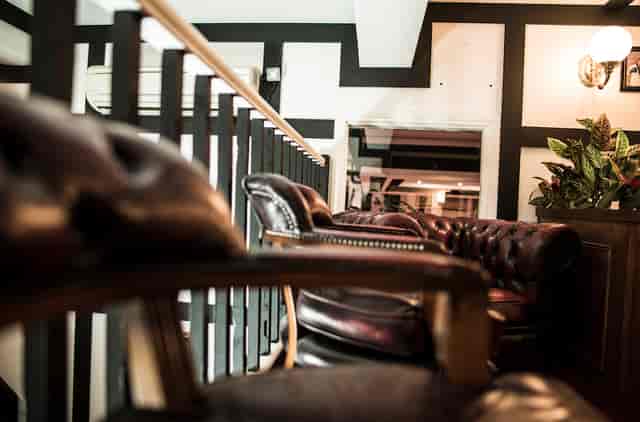 Stylish leather seating in Hunt's Lounge, ideal for networking events and meetings.