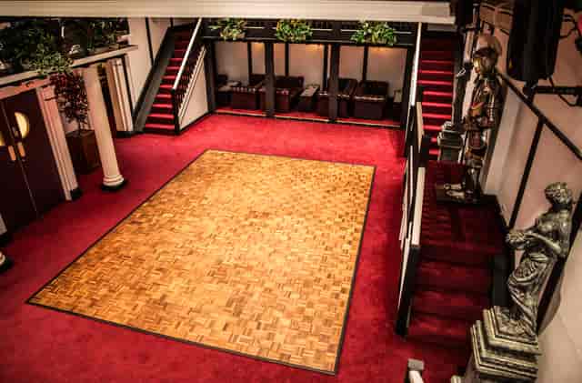 Hunt's Lounge event space with polished dance floor and elegant decor in Chessington.