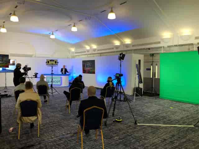 Hybrid event setup in Pavilion Suite 2 at Ascot Racecourse with professional lighting.