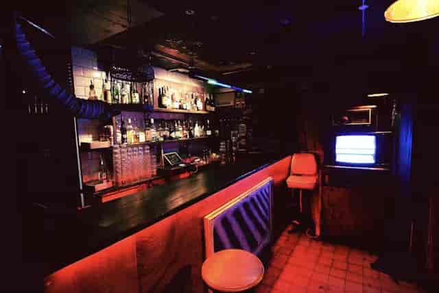 Cozy dimly lit bar at The BSMT, perfect for intimate gatherings and networking events.