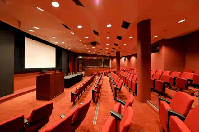 Auditorium in SCI Belgravia with tiered seating for conferences and lectures.