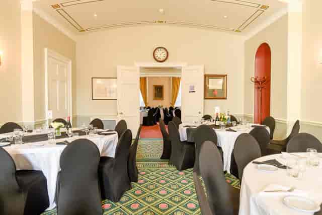 Council Room at SCI Belgravia, elegant round tables, ideal for meetings and events.