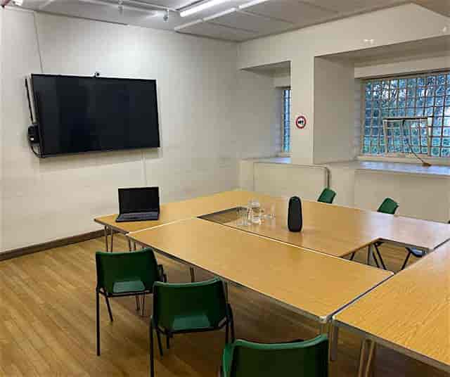 Seminar Room at Barnsbury Community Centre with central table for meetings and presentations.