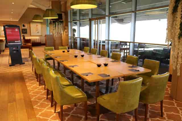 Royal Ascot Racing Club meeting room with wooden table and plush chairs for executive events.