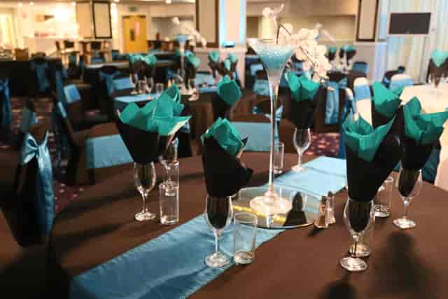 Elegant event space in Viva Blackpool with turquoise accents and stylish table settings.