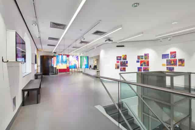 Modern event space in The City Centre with vibrant artwork for meetings and exhibitions.