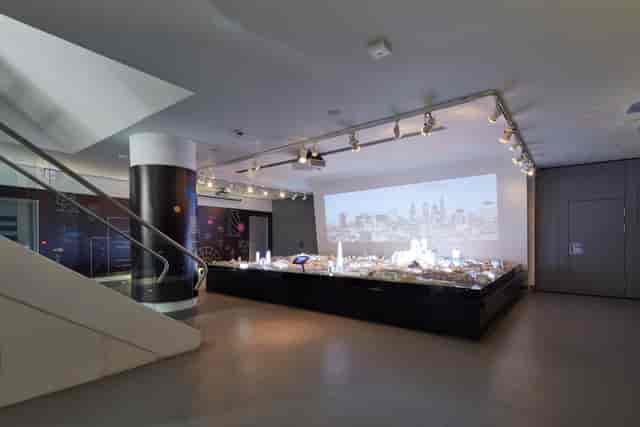 City Centre breakout space with urban planning model for architectural events and networking.