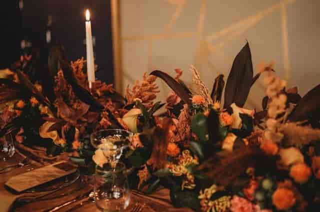Elegant table setting with floral centerpiece for weddings and upscale events.