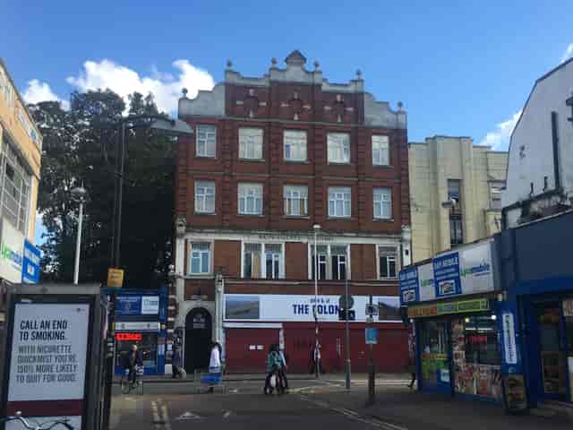 Vibrant urban event space at 133 Rye Lane, featuring historical architecture.