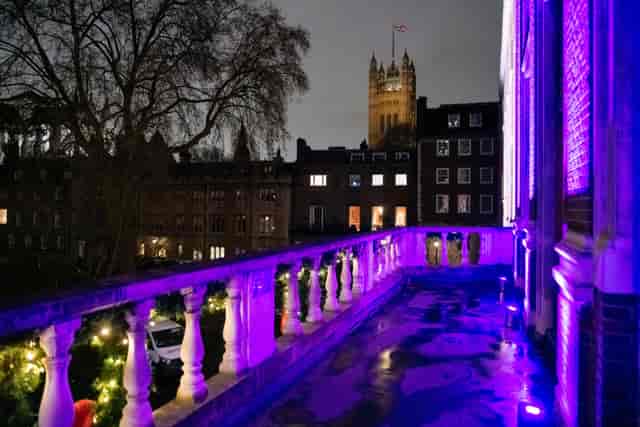 London VIP corporate reception, purple uplighting, historic hall