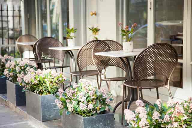 Outdoor café setting at Trishna, perfect for casual meetings and networking events.