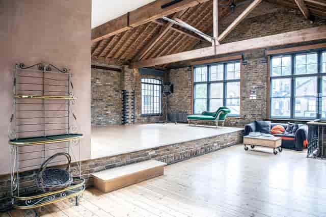 Spacious event venue with rustic charm, ideal for meetings and workshops.