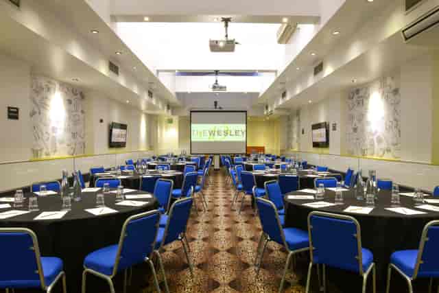 Porter Hall meeting space with round tables, ideal for professional events and conferences.