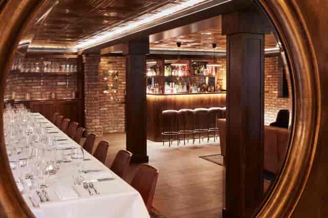 Sophisticated Function Room with warm lighting for corporate events and intimate gatherings.
