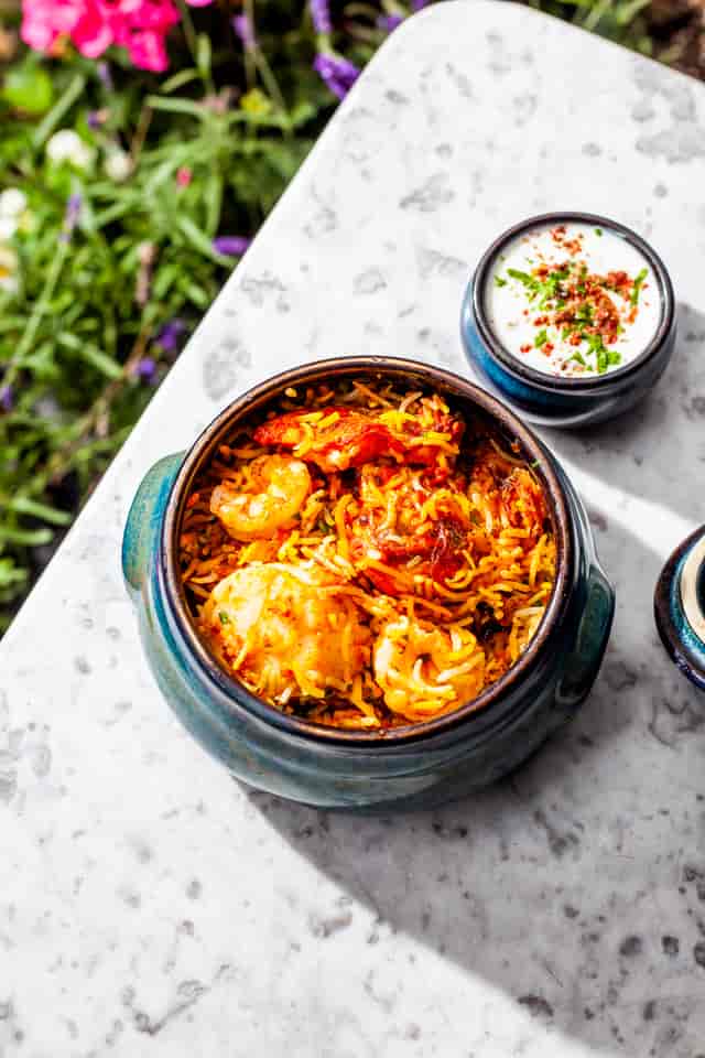 Biryani with shrimp at Trishna for memorable event catering and dining experience.