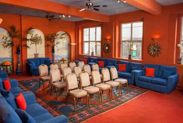 The Orangery London Art House: Bold orange breakout space for workshops and panel discussions.