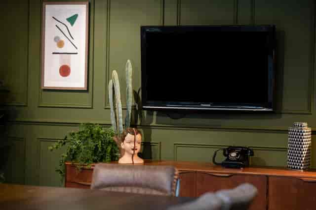 Stylish meeting room with green walls at The Social Boardroom, Fazeley Studios.