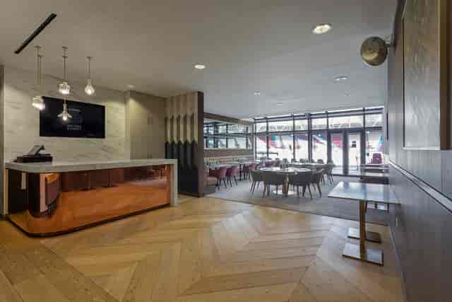 Modern event space in London Stadium with elegant reception for meetings and networking.