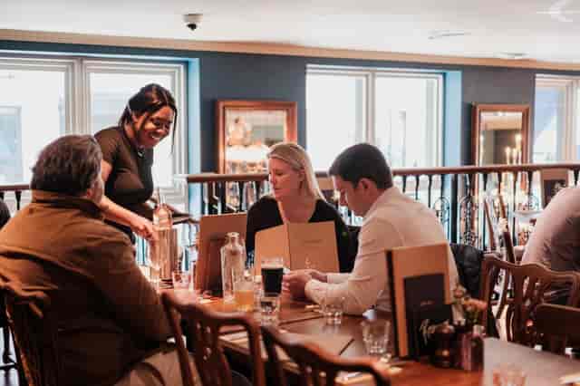 Cozy dining at The Quarter Deck, ideal for networking events with warm ambiance.