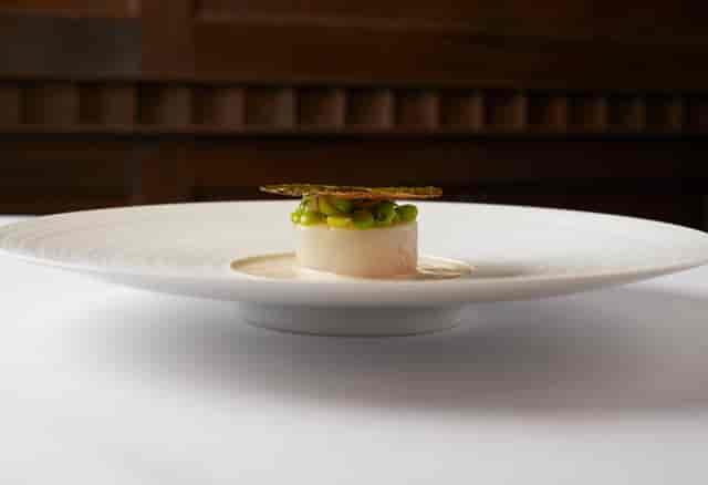 Elegant plated dish in The Clarges Suite, Flemings Mayfair Hotel for upscale events.