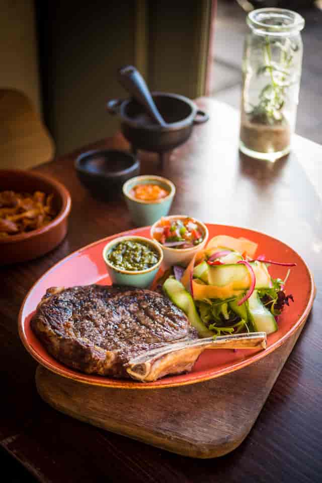 Grilled steak with salad and salsas in Las Iguanas Edinburgh event space.