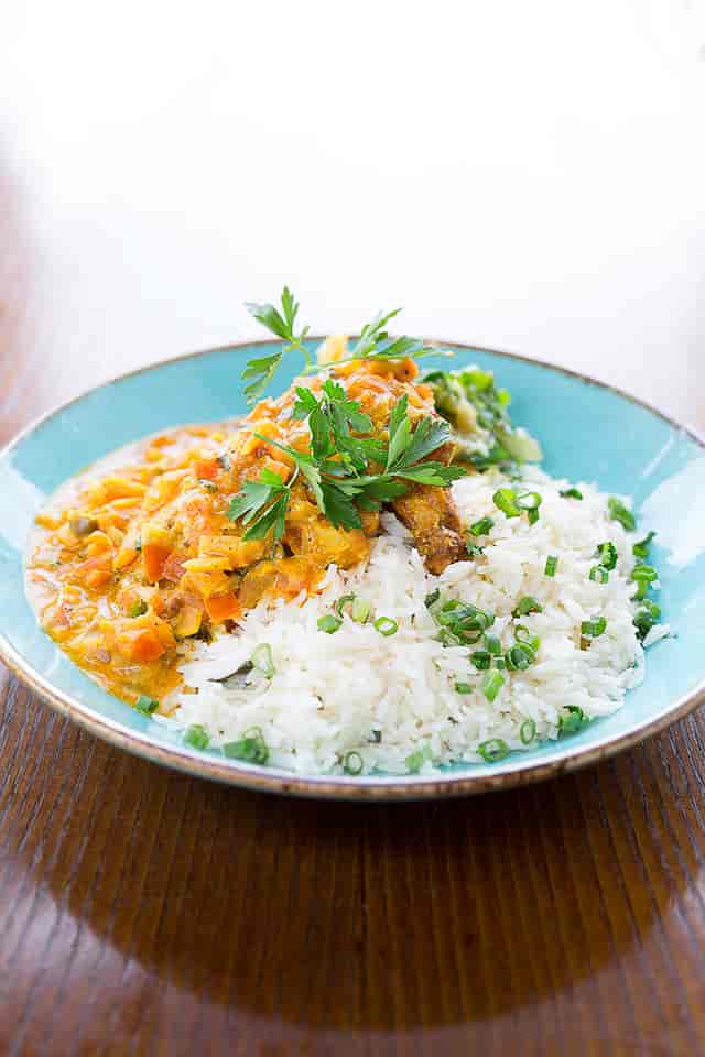 "Plated chicken dish with rice at Las Iguanas Edinburgh for events and catering."