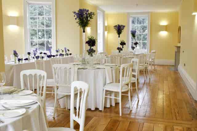 Elegant event space in Clissold House with round tables, ideal for receptions and gatherings.