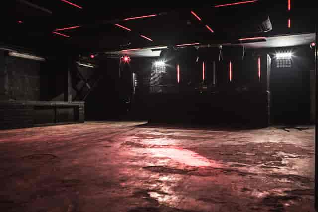 Versatile industrial event space with dynamic lighting at The Blackbox, ideal for parties and performances.