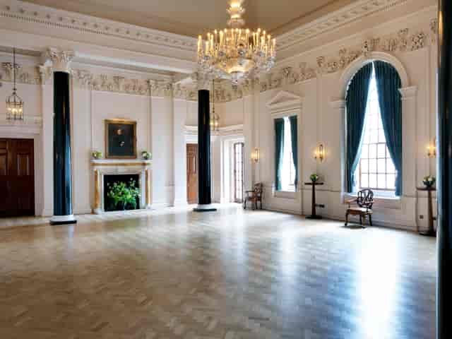 Elegant event space with high ceilings at The Saloon, perfect for upscale gatherings.