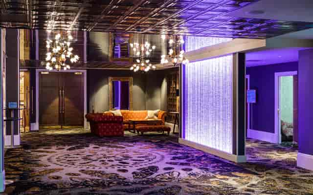 Alan Turing in a stylish event space with elegant lighting for networking and gatherings.