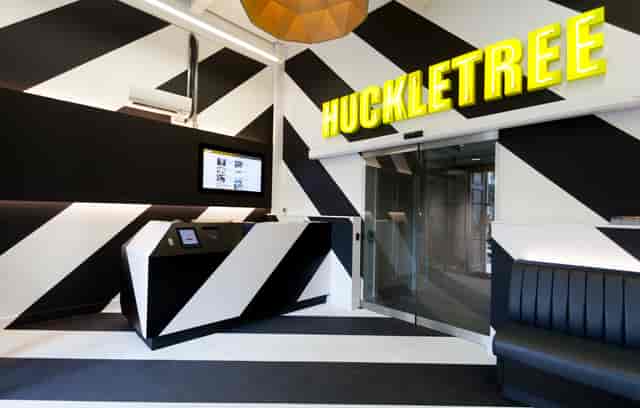 Modern tech auditorium with bold branding, ideal for professional conferences and corporate events.
