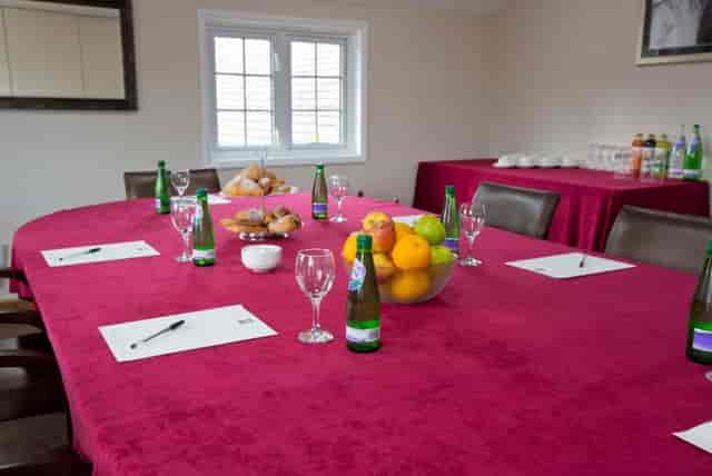 Boardroom at Sandford Springs Hotel, round table setup for meetings and events.