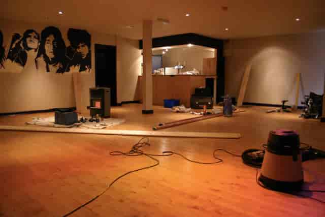 Partially set-up event space at The Tower of Song, showcasing pre-event preparations.