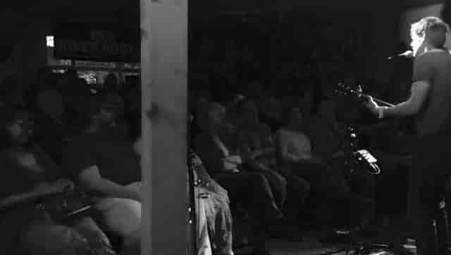 Intimate live performance venue with cozy lighting at The Tower of Song.