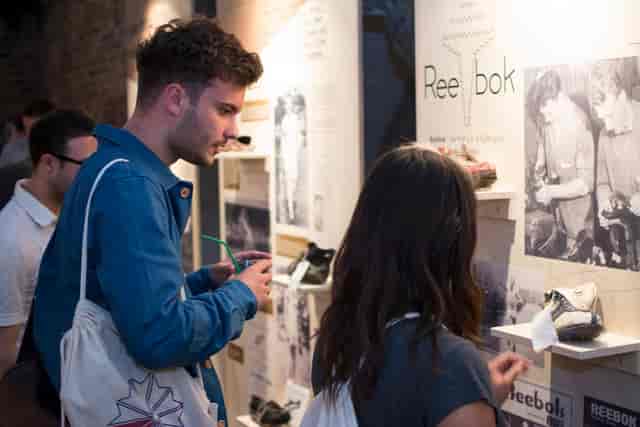 Engaging event setup in Shoreditch Studios with interactive displays for networking.
