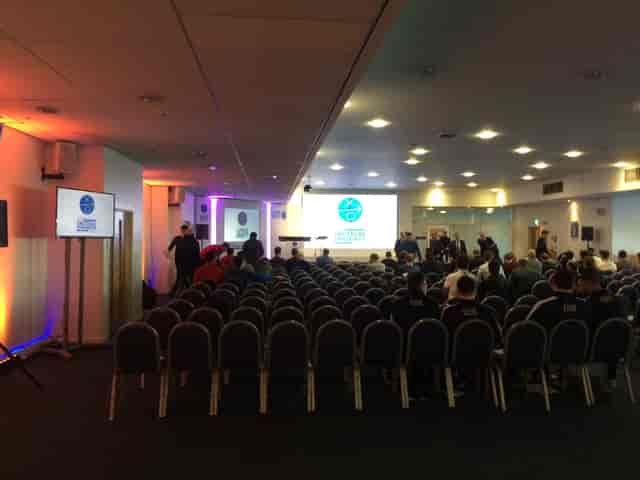 Keith Weller Lounge event space with chairs set for presentations at Leicester City FC.